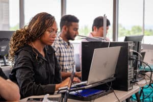 ActivateWork learners working on computers during and in-person lab day