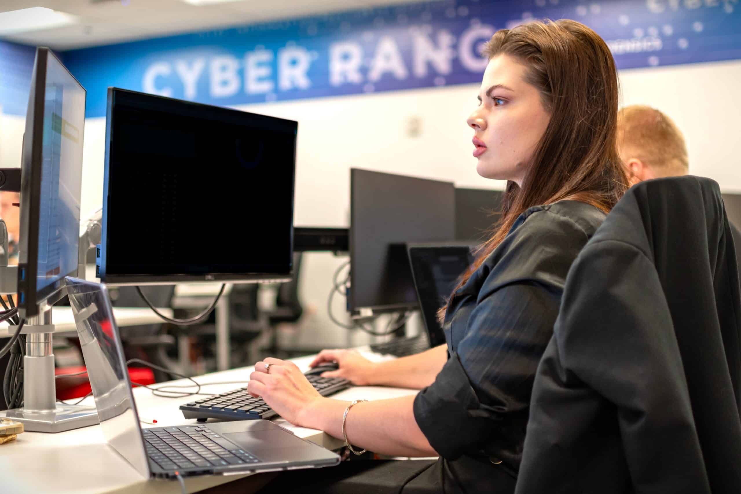 An ActivateWork learner working at a computer station in the MSU Cybersecurity Range