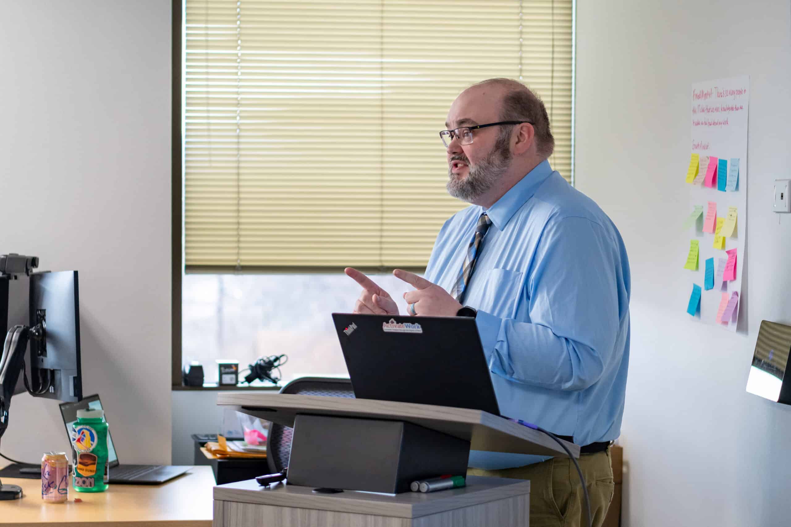 Fred Delehoy delivering a keynote address at his cohort's graduation