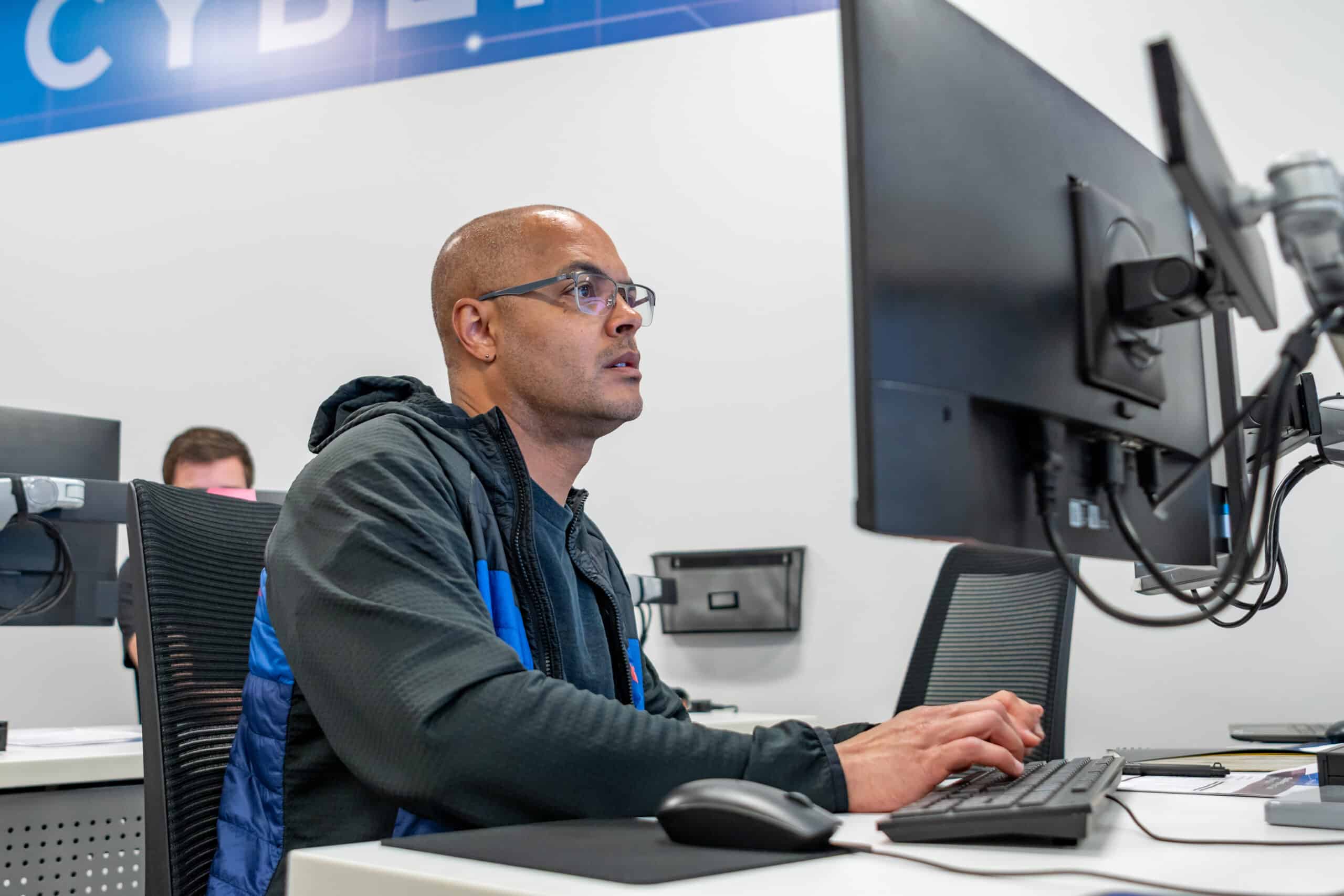 An ActivateWork learner works to respond to a simulated cyber attack during a live-fire training scenario at MSU Denver's Cyber Range