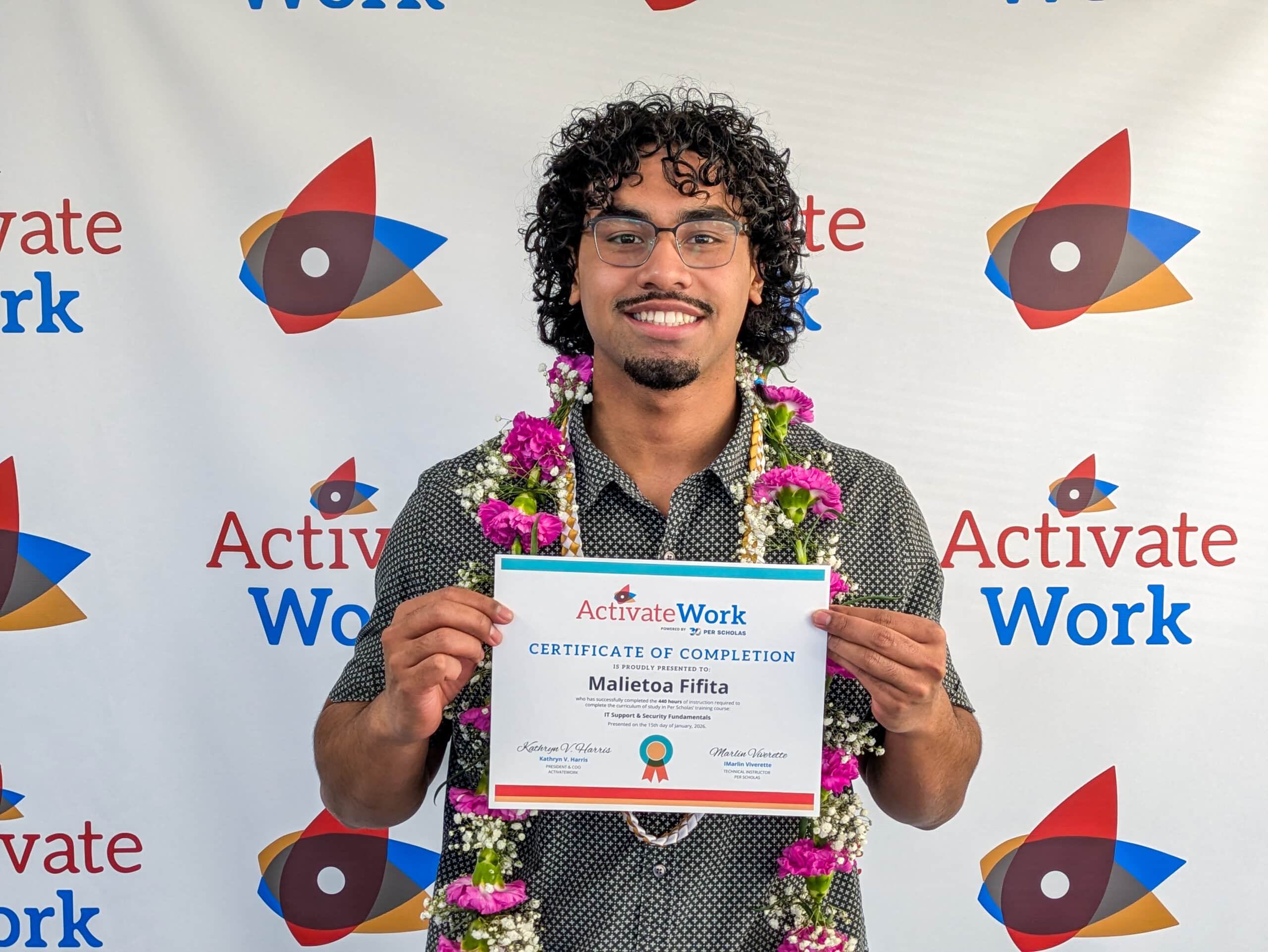 Toa Fifita smiling and holding his certificate of completion at his graduation from ActivateWork's IT Support and Security Fundamentals program.