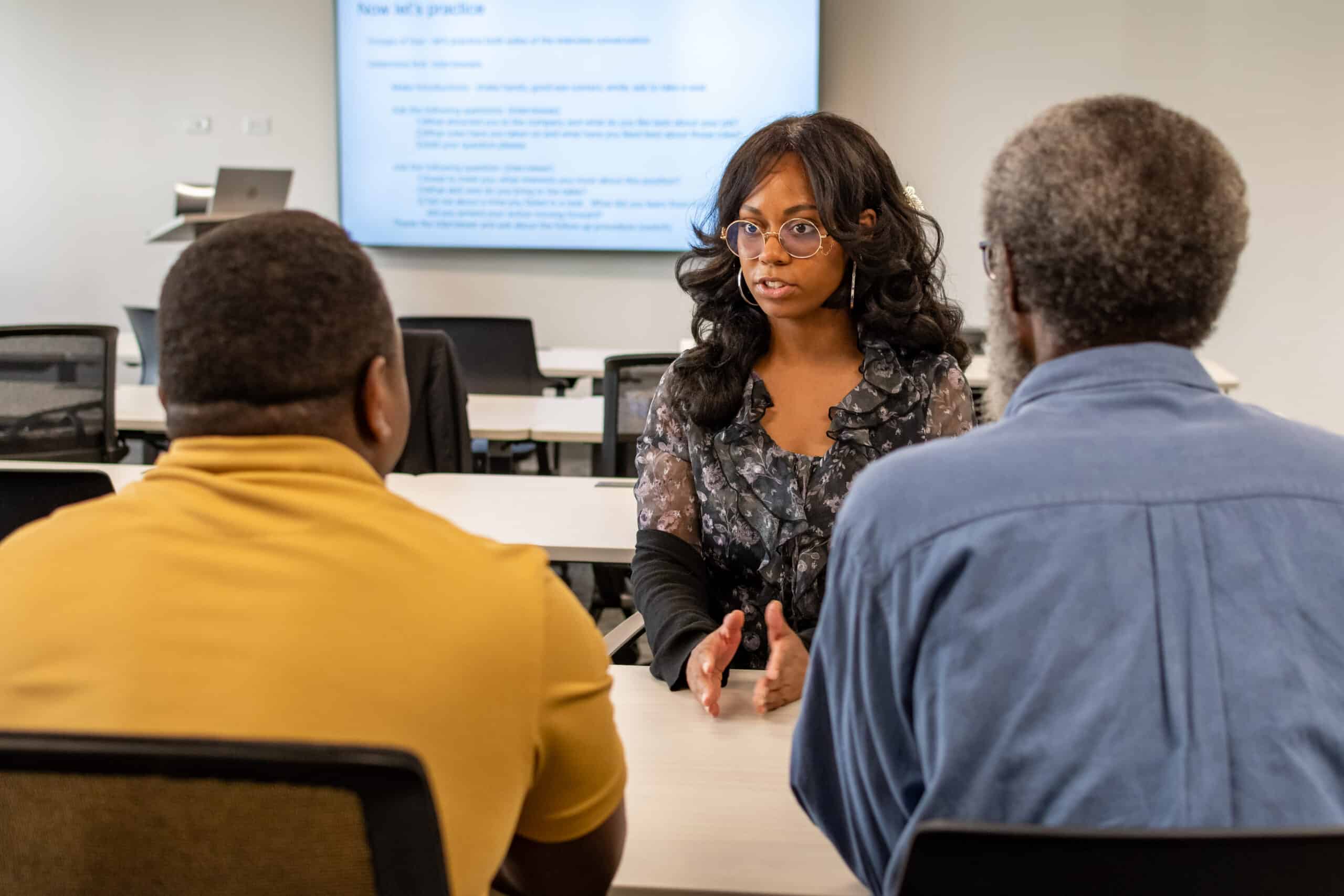 An ActivateWork learner practices communicating her skills and experience during a mock interview session.