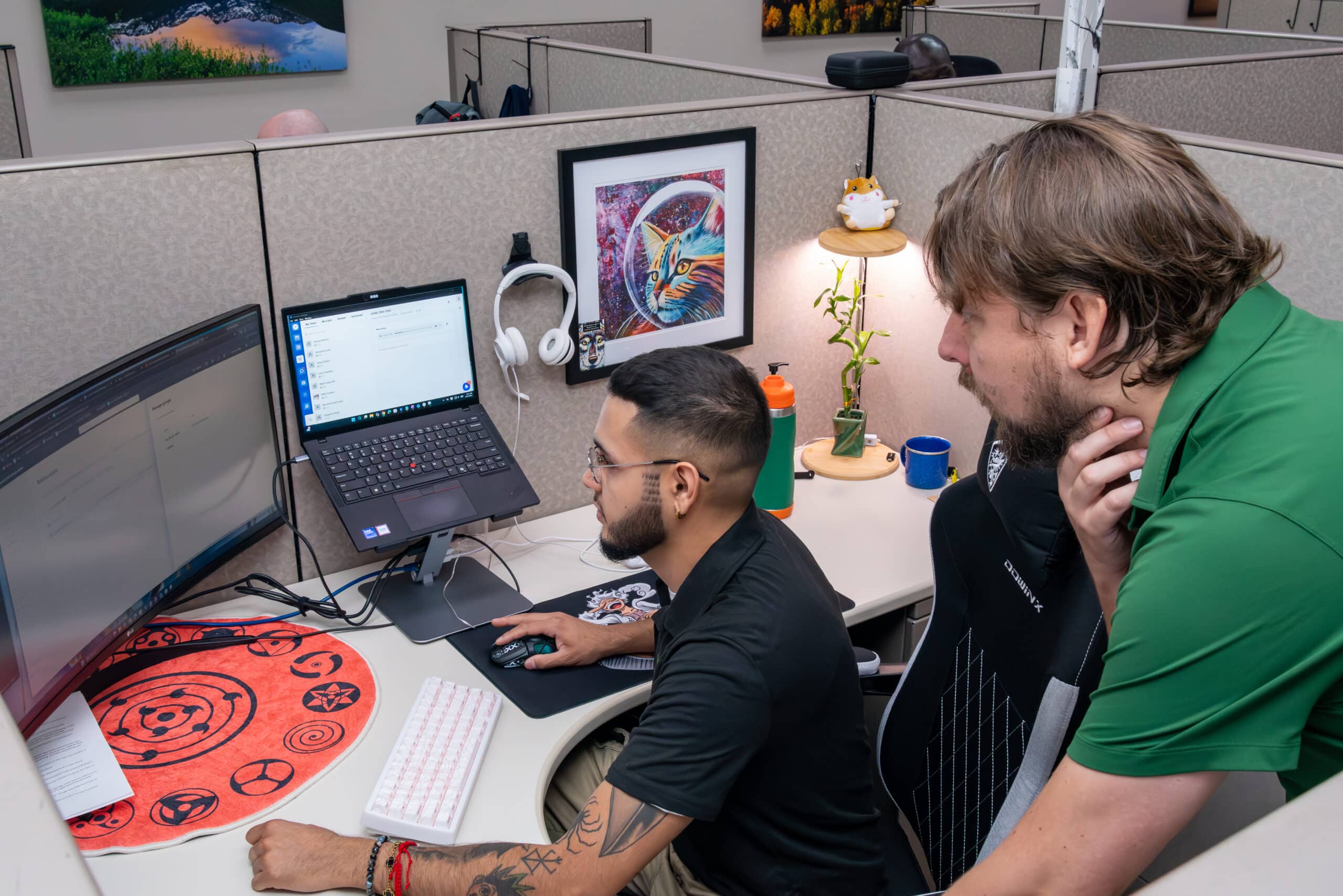 TeamLogic IT CTO Danny Ramey reviews an IT support ticket with Apprentice Jaime Rubio.